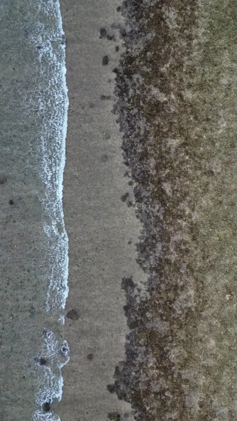 Waves drone going down vertical 스톡 동영상 240096946