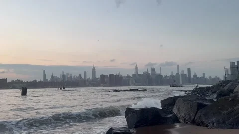 Waves of East River viewing Manhattan Skyline Stock Footage 248868613