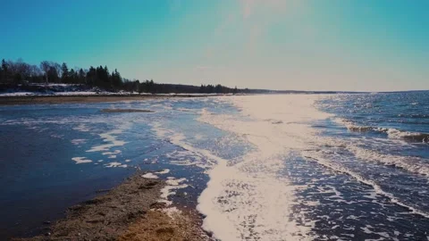 Waves on an empty beach in afternoon light Stock Footage 149305278