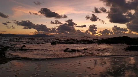 Waves entering the puddle at sunset Stock Footage 135353681