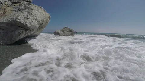 Waves in an Exotic Rocky Beach Stock Footage 75885966
