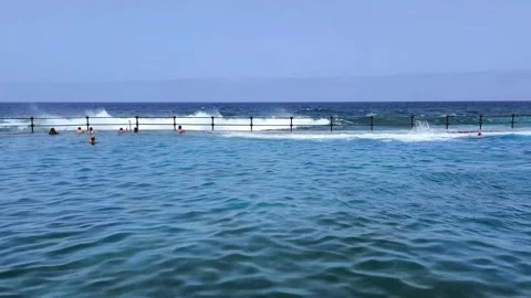 Waves explode against Bajamar natural pools. Stock Footage 329247035