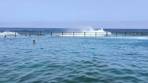 Waves explode against Bajamar natural pools. Stock Footage 329247048
