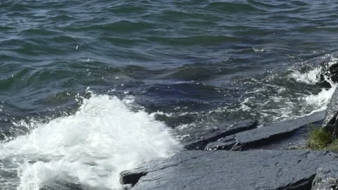 Waves On Flathead Lake Crashing Onto Rocks Close Up Video stock 204110510