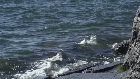 Waves On Flathead Lake Crashing Onto Rocks Video stock 204110554