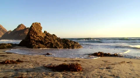 Waves flowing around rocks at sunset Stock Footage 43241203