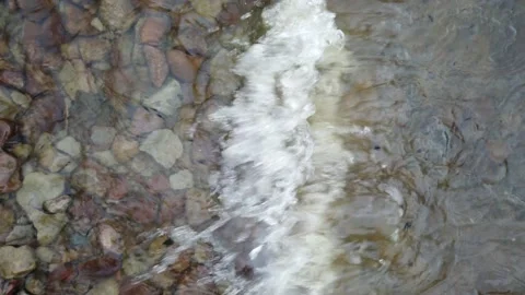 Waves flowing over a river bed Stock Footage 143729615