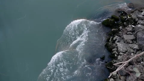 Waves flowing in the river with stone Stock Footage