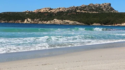 Waves with foam crushing on the beach  Stock Footage 128933326