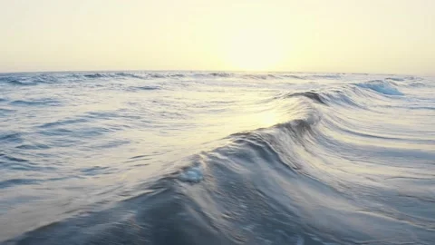 Waves foaming and splashing in the sea. Drone footage, sunset wavy seascape Stock Footage 155479219