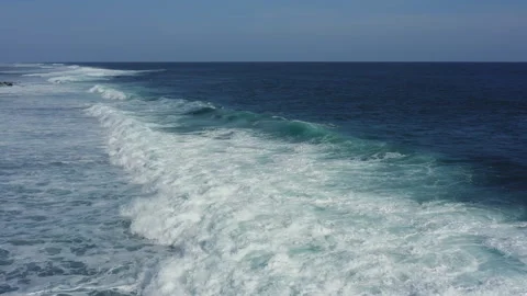 Waves foaming in the blue ocean Stock Footage 260856633