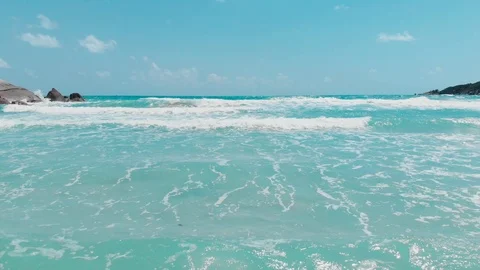 Waves forming in the ocean under a blue sky aerial 스톡 동영상 111644200