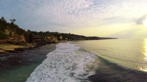 Waves in front of Cliffs and Beach in Bali flyover 스톡 동영상 52313573