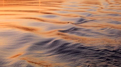 Waves generated by a boat on the sea at sunrise Stock Footage 47402925