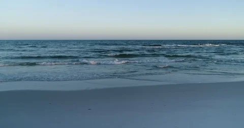 Waves gently arriving at a white sand beach drone aerial 4K Stock Footage 111415909