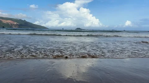 Waves Gently Breaking on a Sandy Beach Stock Footage 311353960