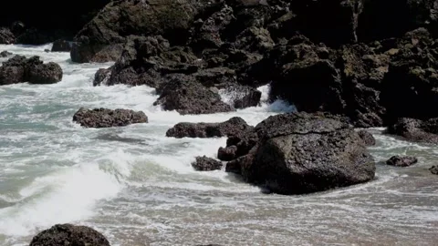 Waves gently crashing against the rocks Stock Footage 319801565