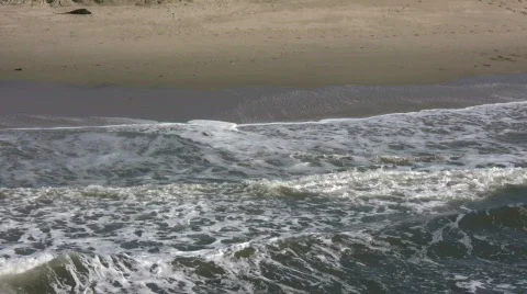Waves gently flow over shore in beach scenic (High Definition) Stock Footage 358822