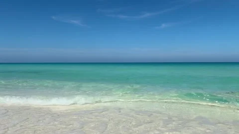 Waves gently lap against the shore in Cayo Santa Maria beach, Cuba Stock Footage 306022071