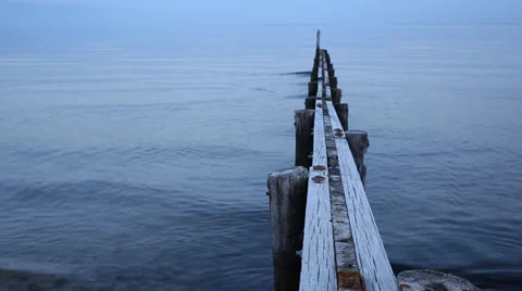 Waves gently lapping jetty Stock Footage 39535502