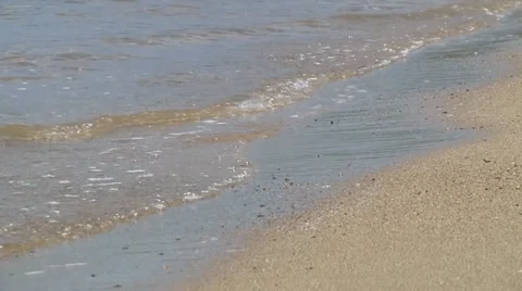 Waves gently roll in closeup Video stock 30980721