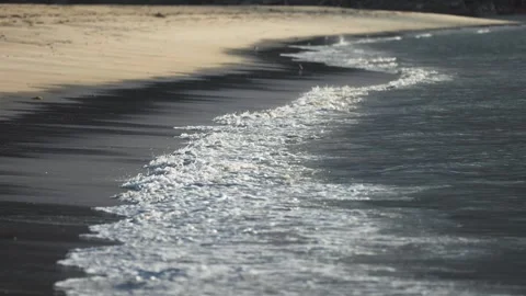 Waves gently roll onto the sandy beach. Parallax video. Stock Footage 248692991