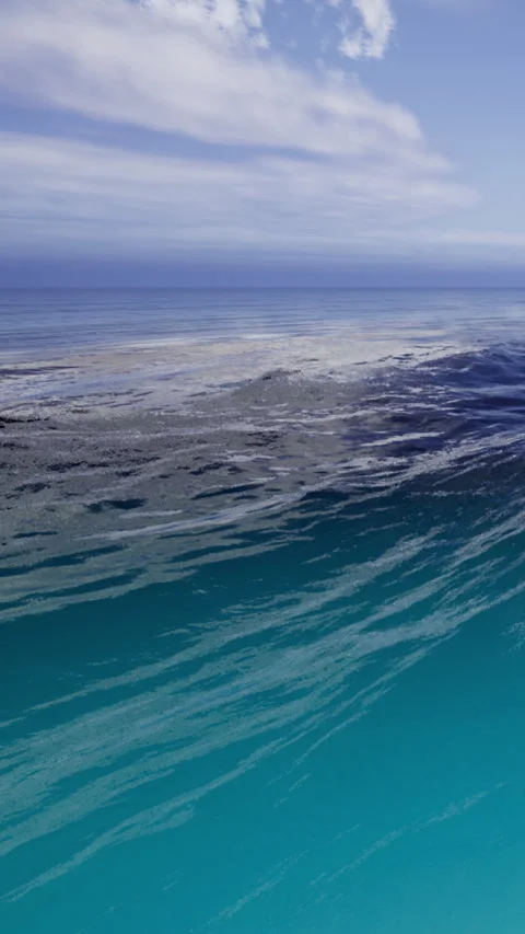 Waves gently roll towards the shore, shimmering in shades of blue and turquoise Stock Footage 340077330