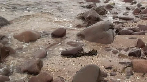 Waves gently rolling onto the beach Stock Footage 44334940