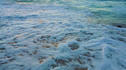 Waves Gently Rolling Up the Beach at Sunset. Shot with Steadicam in Hawaii. N Stock Footage 53892937