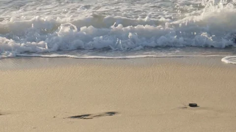 Waves gently rolling up sand shoreline Stock Footage 172564511