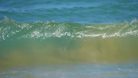 Waves gently rolling onto the sandy beach in slow motion in slow motion 300fp Stock-Footage 283458389