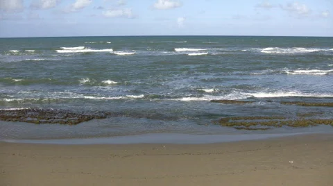 Waves gently wash up onto beach, then recede (High Definition) Stock Footage 65573