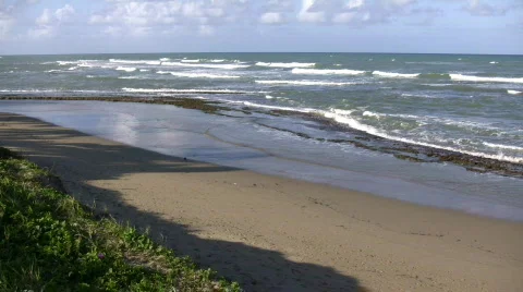 Waves gently wash up onto beach, then recede (High Definition) Stock Footage 65574