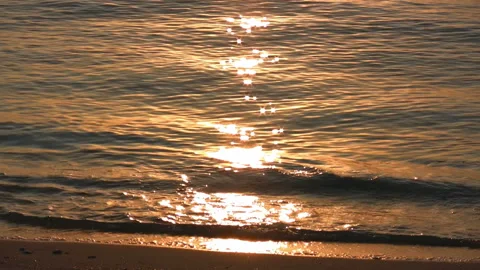 Waves Glimmering in the Sunset Stock Footage 327510485
