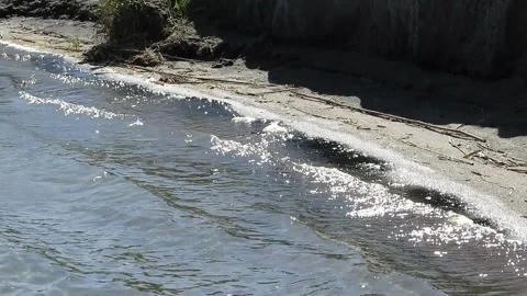 Waves glisten in the sun Stock Footage 139114790