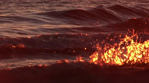 Waves glistening in the setting sun Stock Footage 156883062