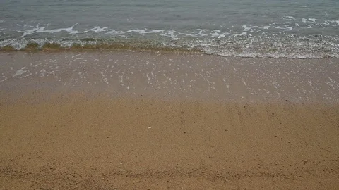 Waves on golden sand Stock Footage 120708465