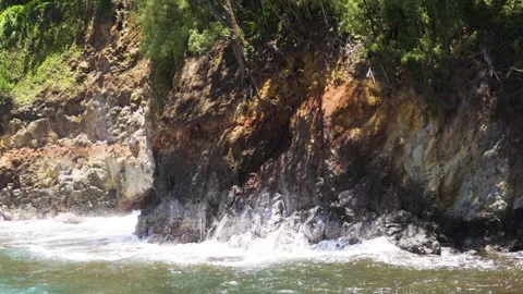 Waves Hammer Rugged Sea Cliffs, Spray Explodes on Dark Rocks Stock Footage 315157361