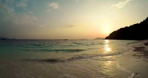 Waves Hit The Andaman Beach At Sunset Stock Footage