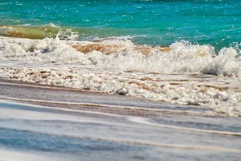 Waves hit the beach Stock Photos