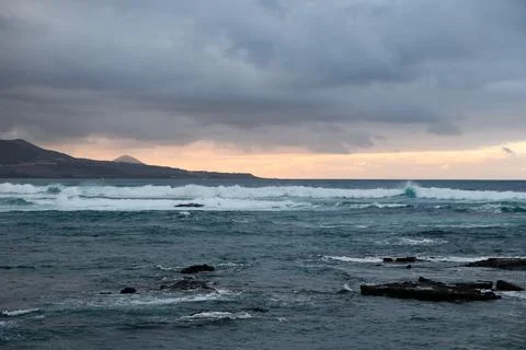 Waves hit breakwater Stock Photos