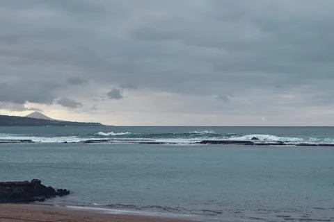 Waves hit breakwater Stock Photos