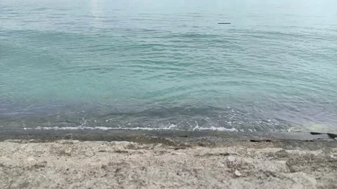 The waves hit the concrete on the beach. 動画素材 196985072