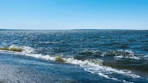 Waves hit a concrete slab on the shore. Stock Footage 154307181