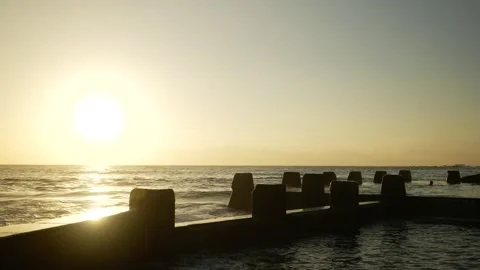 Waves hit Coogee's Ocean Pool at sunrise 6K Stock Footage 306344961