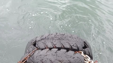 The waves hit the dapra tires Stock Footage 277201309