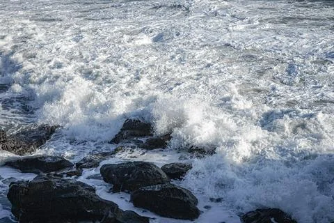 Waves that hit the rock. Stock Photos