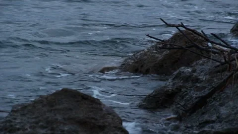 The waves hit the rocks on Mamuju beach in the morning Stock Footage 237905949