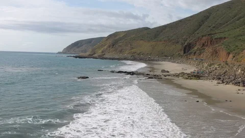 Waves hit rocks on the ocean Stock Footage 127583357