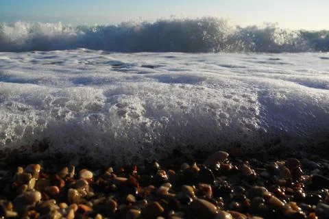 Waves hit the shore Stock Photos